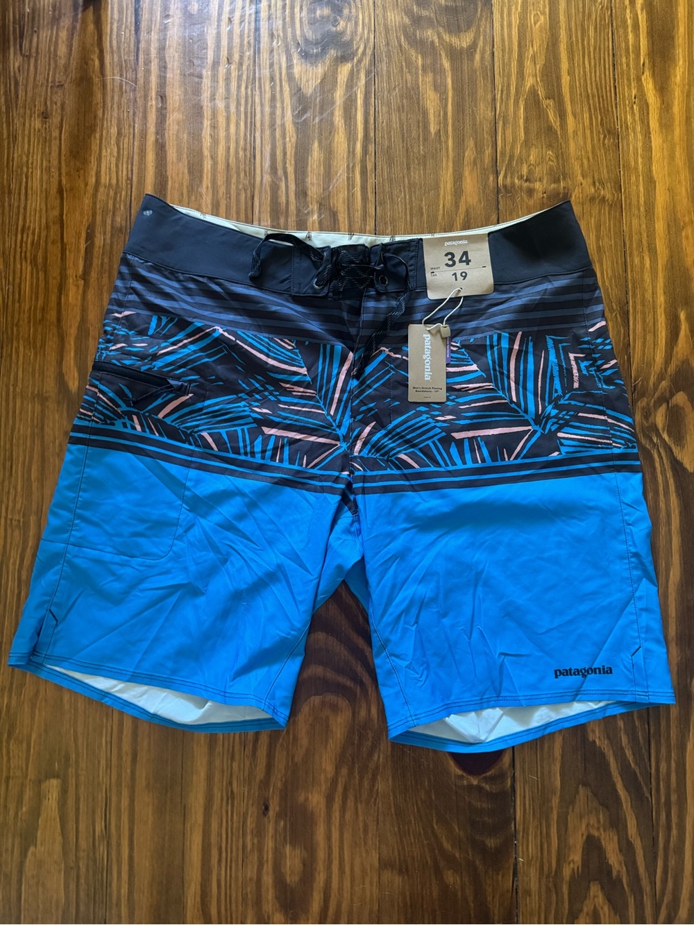 Patagonia Men’s Blue Board Shorts with Black & Pink Accent Stripe